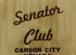 Matchbook cover with words Senator Club, Carson City, Nevada on stained wood-looking background